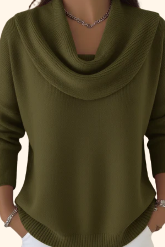 Model wearing Elina comfort fit pants in a vibrant green, styled casually with a white top.