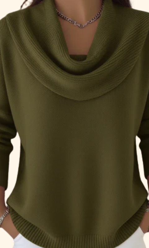 Model wearing Elina comfort fit pants in a vibrant green, styled casually with a white top.