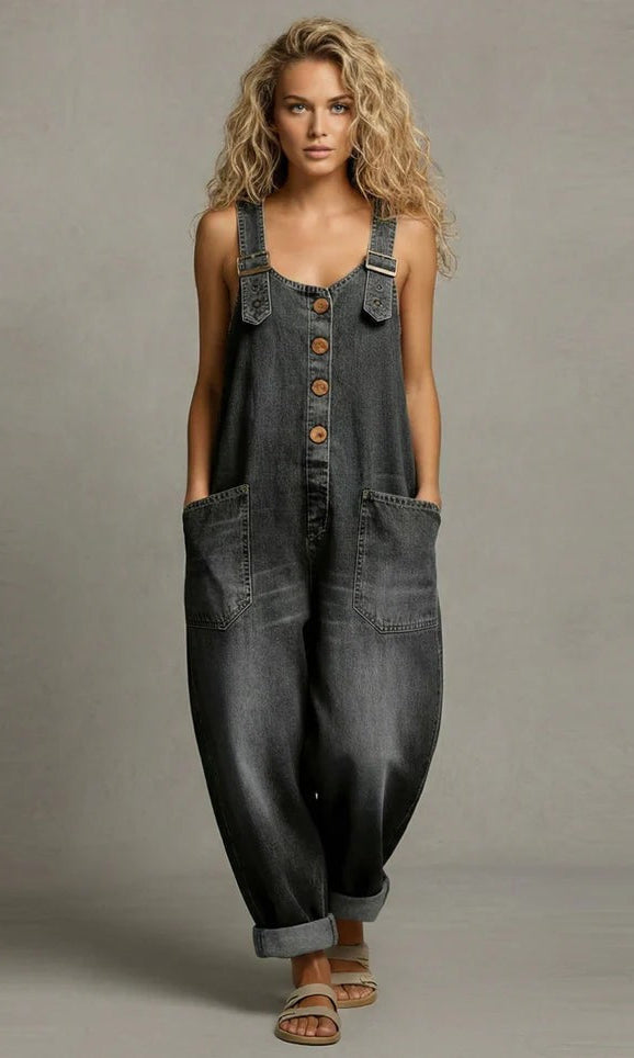 The Suri chic utility jumpsuit laid flat, showing the adjustable straps and fabric texture.