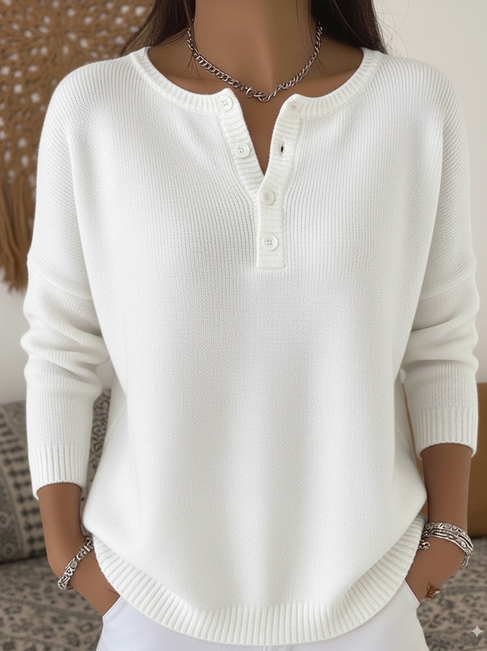 Close-up detail of the subtle buttons on the waistband of the comfortable button-up pants.