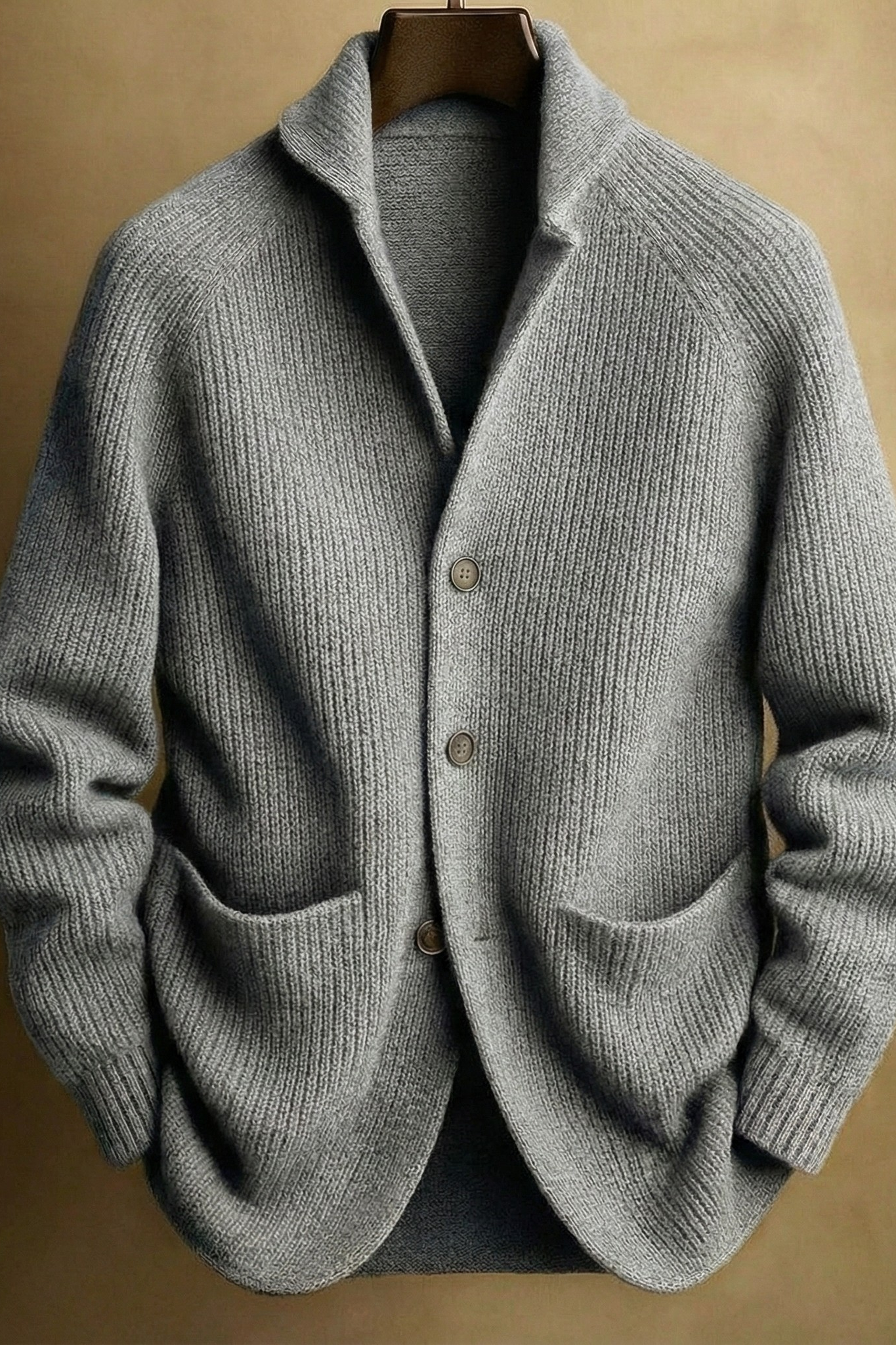 Hand in the front patch pocket of the Florian cardigan, demonstrating the practicality and size of the pockets.