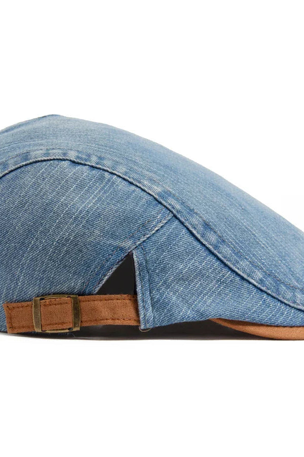 Overhead shot of the dark blue flat cap on a neutral background, emphasizing its symmetrical design.