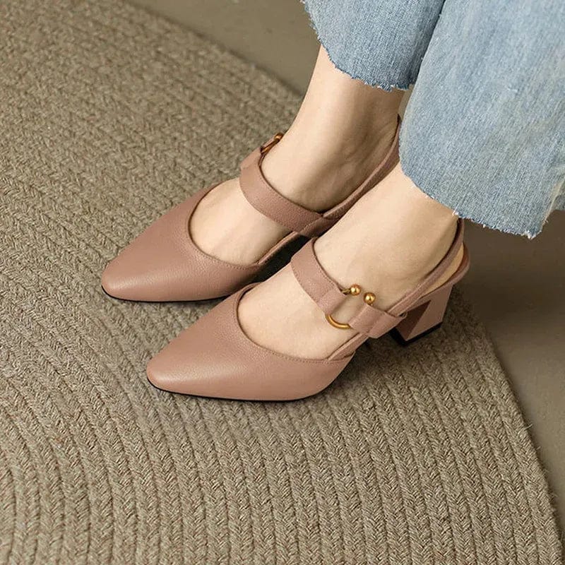 Detailed shot of the gold-tone buckle on the adjustable strap of a leather slingback heel.