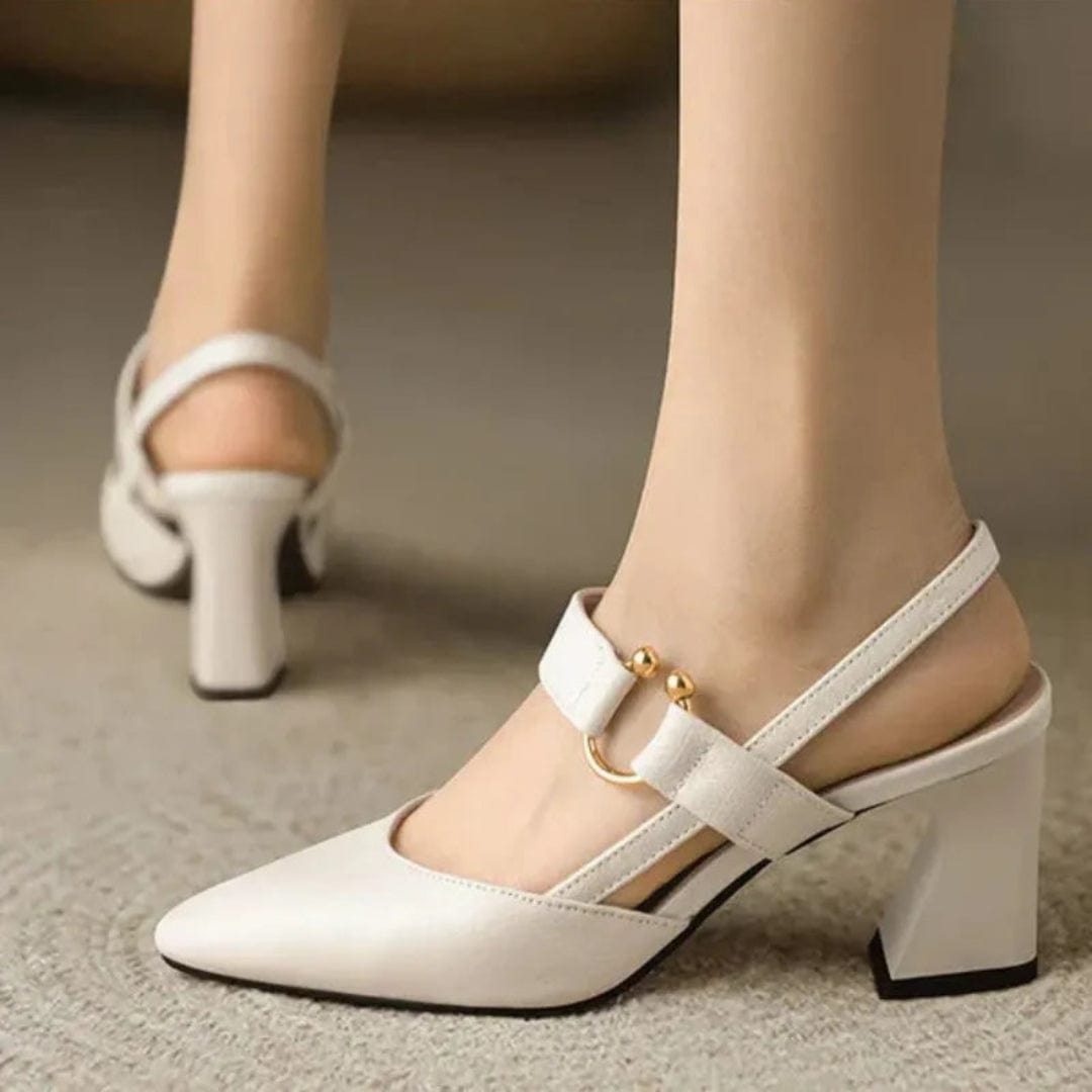 Collection display of black, brown, and beige leather slingback heels, showcasing color options.