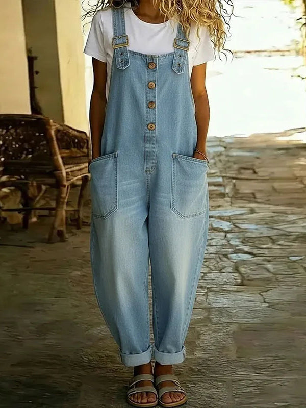 Close-up detail of the adjustable strap and bib pocket on the Hadley soft denim overalls, highlighting the fabric texture.