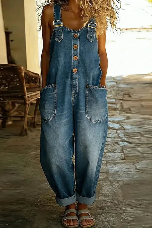 Side view of the Hadley soft denim overalls in blue, demonstrating the comfortable drape and silhouette while standing.