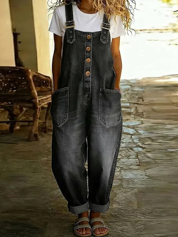 Back view of the black Hadley soft denim overalls, emphasizing the strap design and overall comfortable fit.
