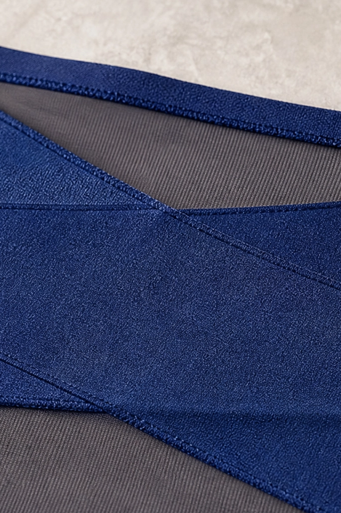 Stack of assorted color high-waisted shaping underwear (blue, black, nude, pink) neatly arranged.