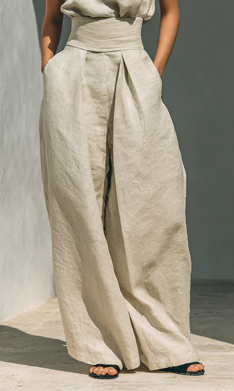 Detail of a deep side pocket on the olive green cotton trousers, perfect for carrying essentials securely.