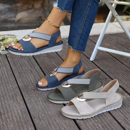 Artemis sandals in beige styled with a summer dress.