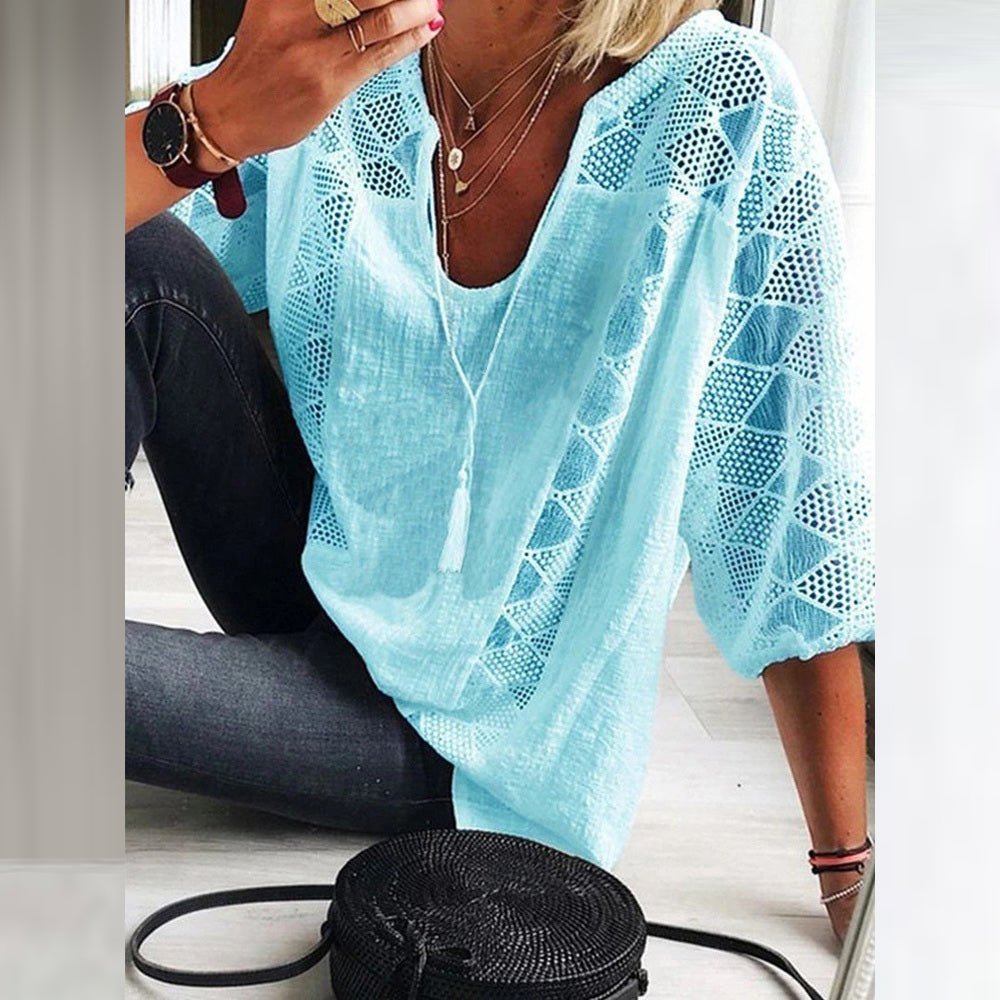 Side profile of a woman wearing the light cotton blouse, highlighting the three-quarter sleeves and fluid drape.