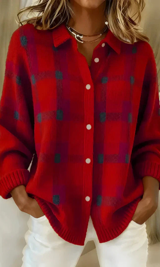 Side profile of the orange Inez button-up cardigan, highlighting the loose fit and button detailing.