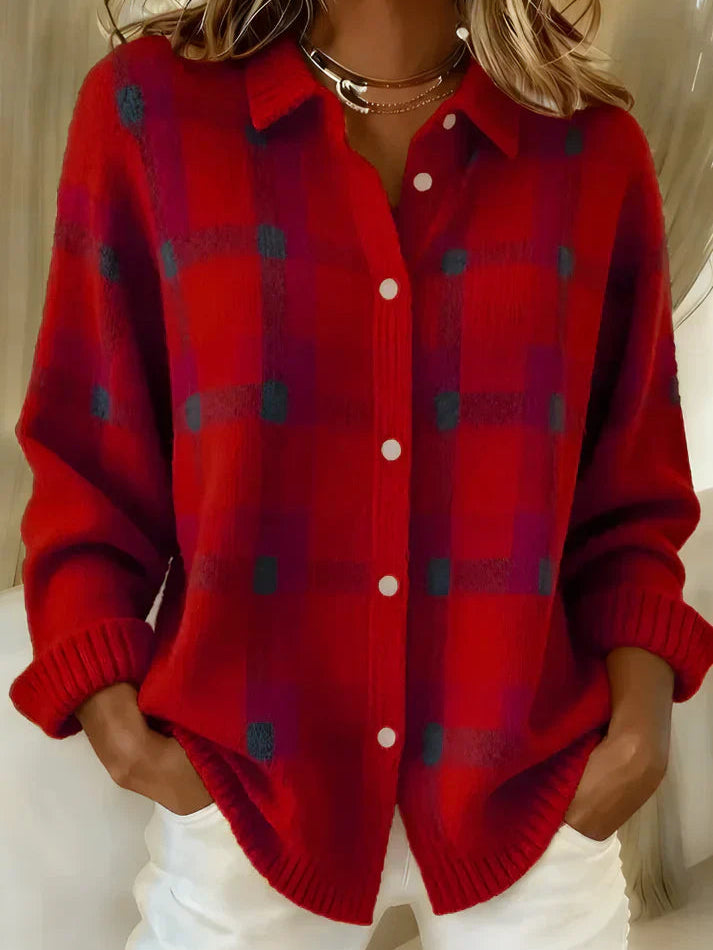 Side profile of the orange Inez button-up cardigan, highlighting the loose fit and button detailing.