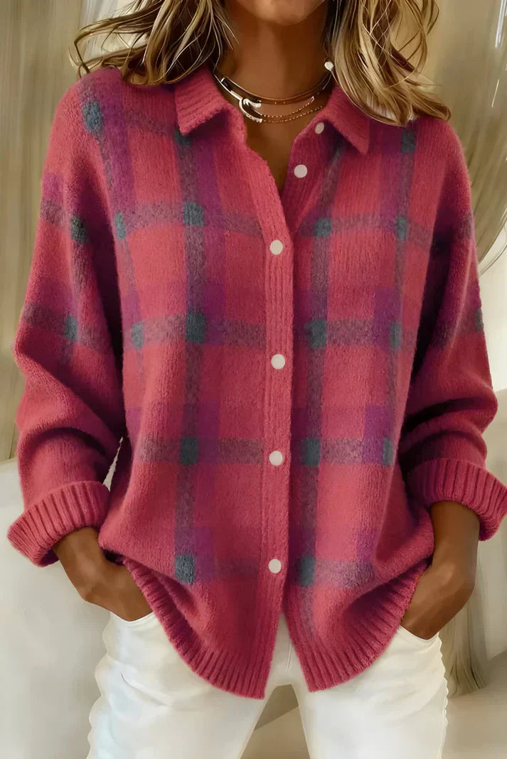 Inez button-up cardigan in green, folded neatly to show its soft material and simple design.