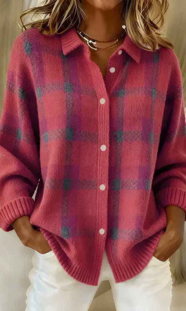Inez button-up cardigan in green, folded neatly to show its soft material and simple design.