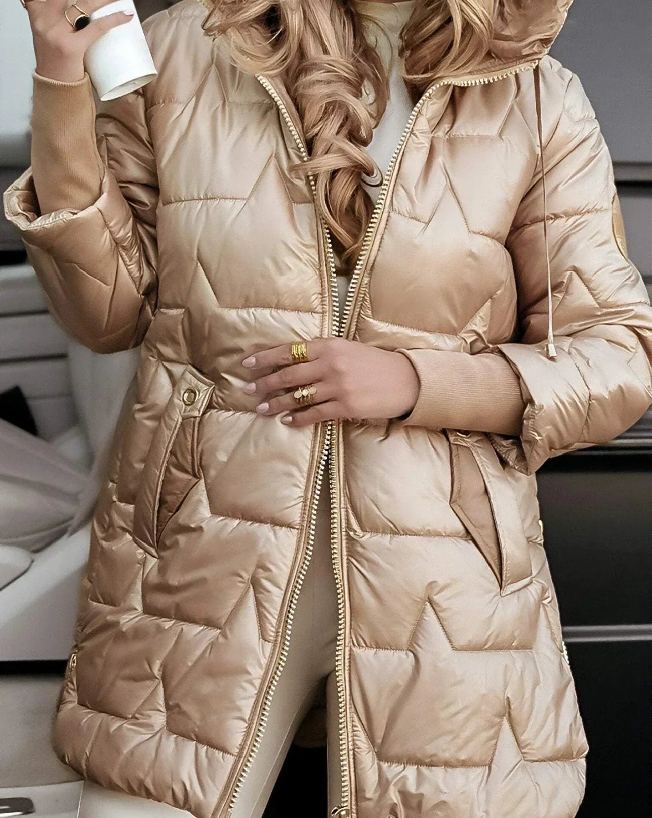 Overhead view of a grey Kiera hooded winter jacket laid flat to show its quilting.