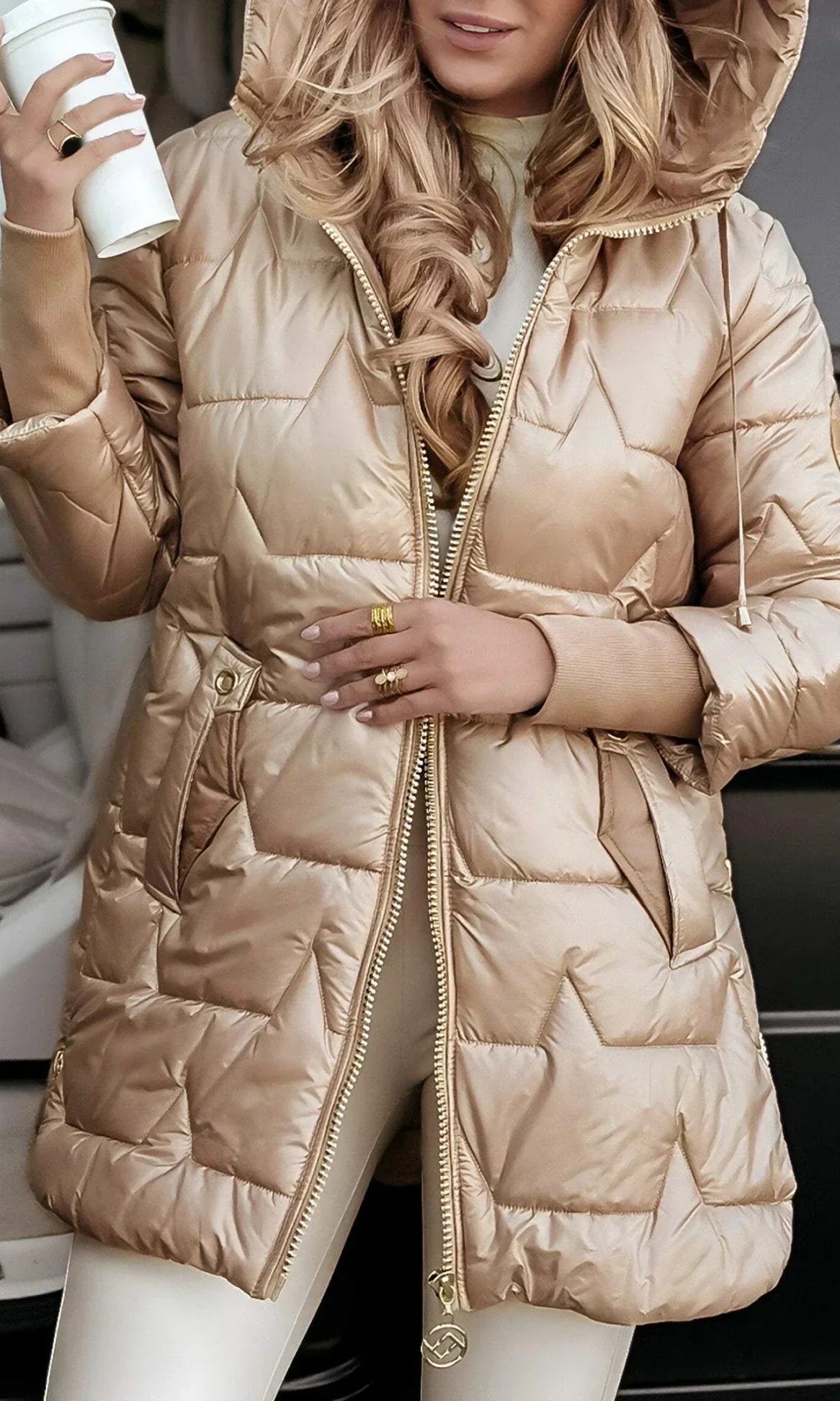 Overhead view of a grey Kiera hooded winter jacket laid flat to show its quilting.
