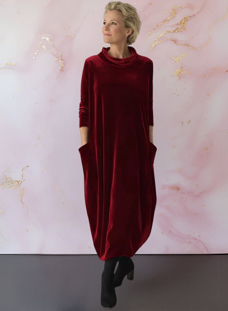 Close-up detail of the Leona velvet maxi dress's modern stand-up collar and luxurious fabric texture.
