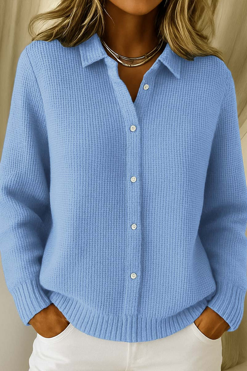 Lila elegant knit cardigan in blue, front view, draped loosely on a mannequin.
