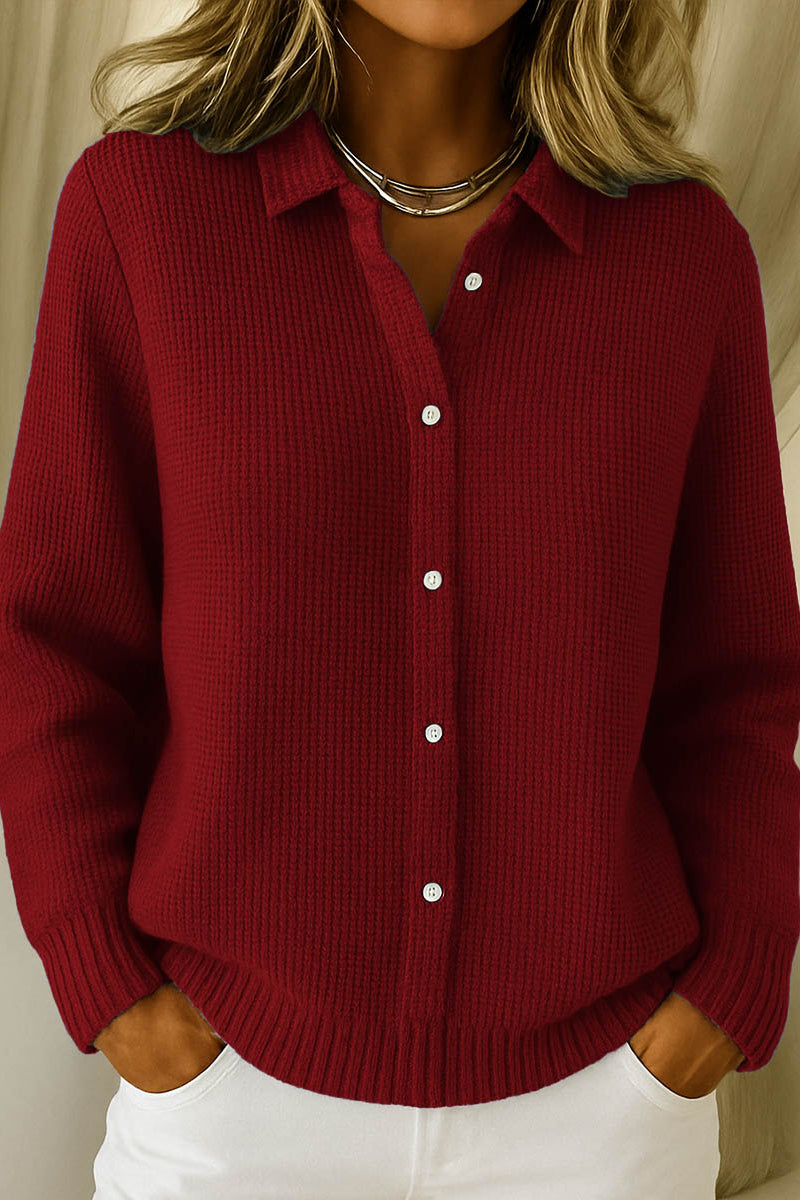 Lila elegant knit cardigan in navy, showcasing the classic collar and long sleeves.