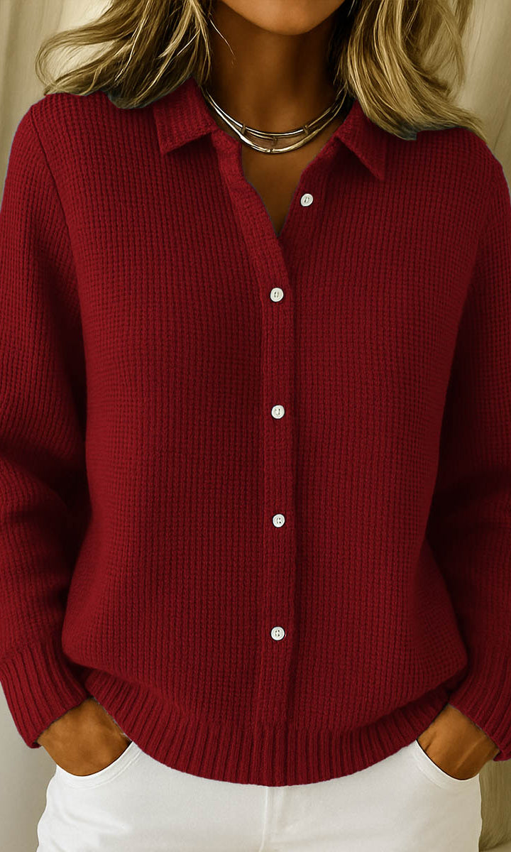 Lila elegant knit cardigan in navy, showcasing the classic collar and long sleeves.