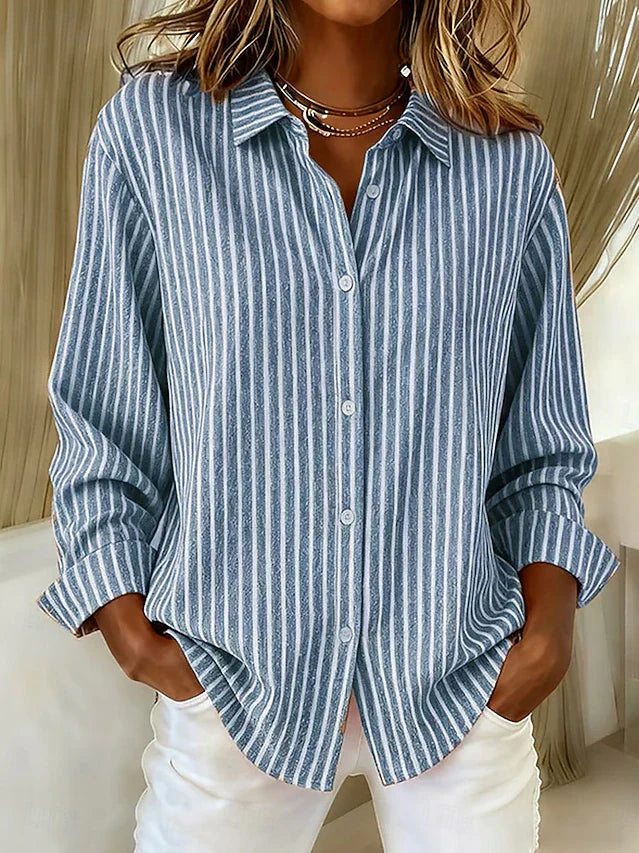 Front view of the blue Linnea relaxed fit shirt, showcasing its classic collar and button closure.