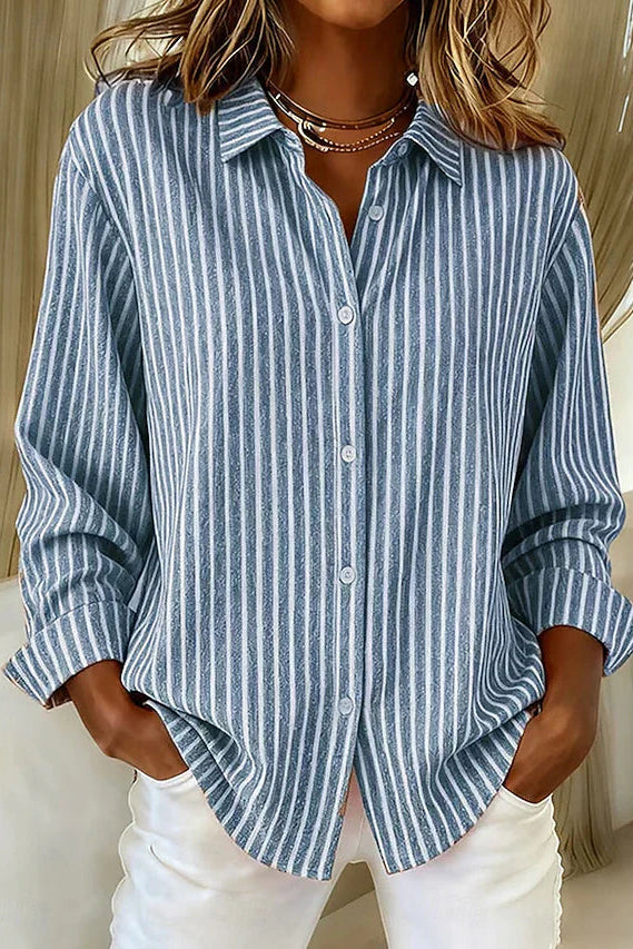 Front view of the blue Linnea relaxed fit shirt, showcasing its classic collar and button closure.