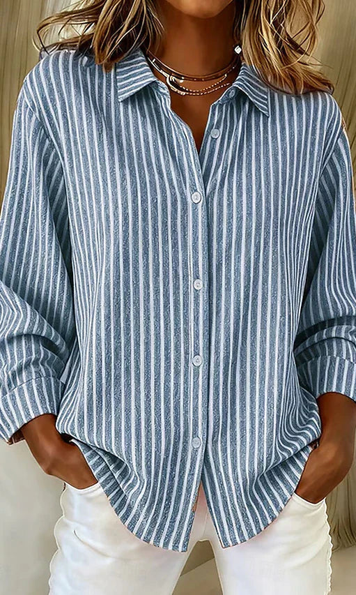 Front view of the blue Linnea relaxed fit shirt, showcasing its classic collar and button closure.