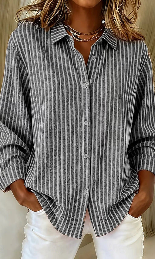 A model casually styled in the gray Linnea relaxed fit shirt, emphasizing its comfortable and unrestricted movement.