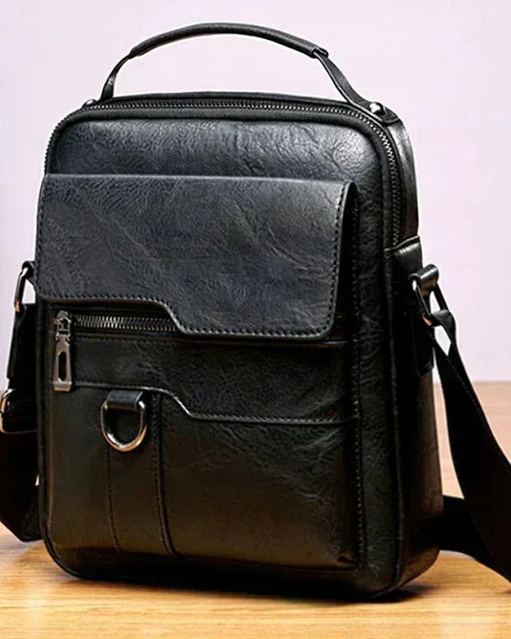 Caleb shoulder bag worn over the shoulder by a man in a professional setting, emphasizing its versatile appeal.