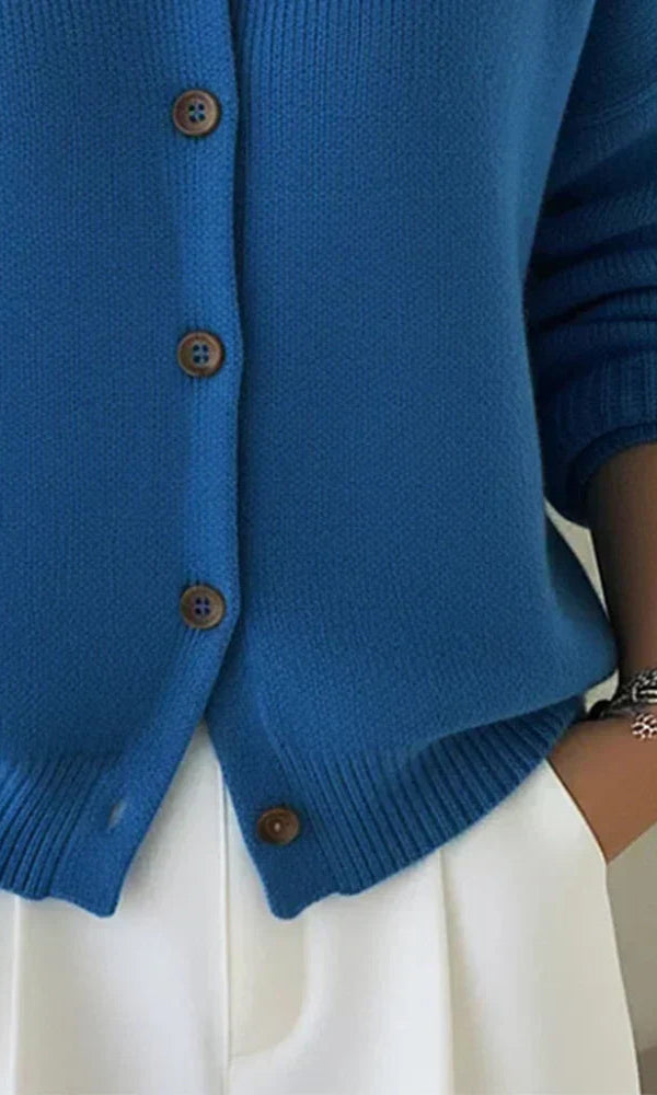 Model wearing the Maeve classic button-up cardigan in red, styled for a casual, comfortable look.
