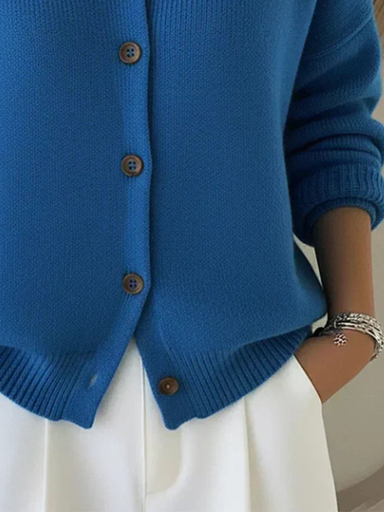Model wearing the Maeve classic button-up cardigan in red, styled for a casual, comfortable look.