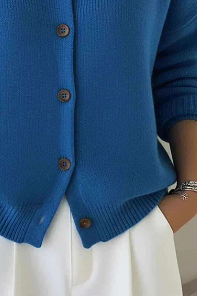 Model wearing the Maeve classic button-up cardigan in red, styled for a casual, comfortable look.