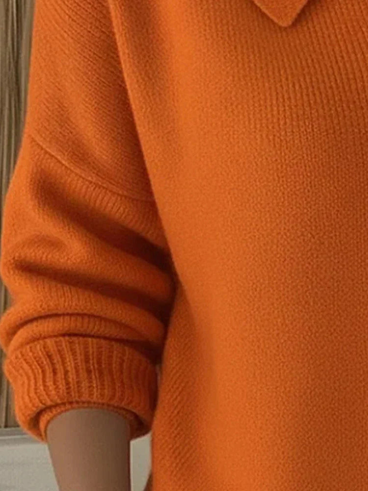 Back view of the Maeve classic button-up cardigan in orange, illustrating its harmonious line and relaxed silhouette.