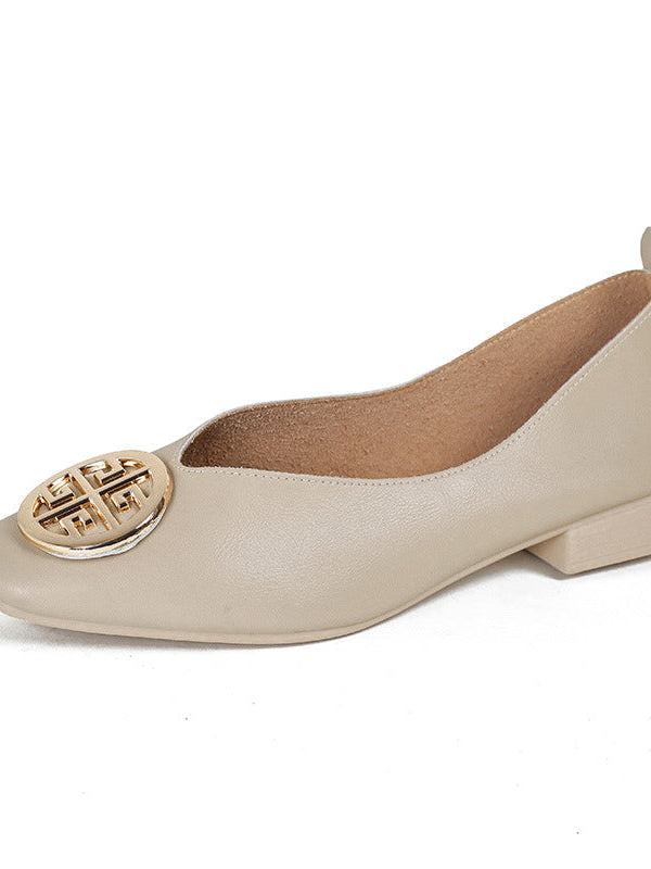 Close-up of a red square-toe flat worn on a foot, emphasizing the comfortable fit and polished appearance of the shoe.