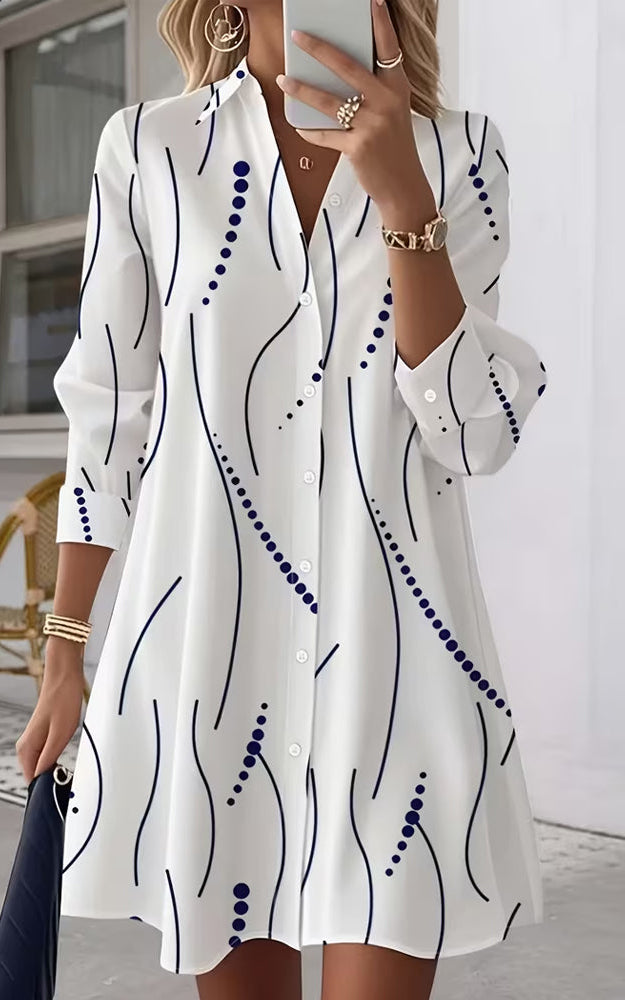 Back view of the Kira striped A-line dress, emphasizing the flow of the cotton blend fabric and overall silhouette.