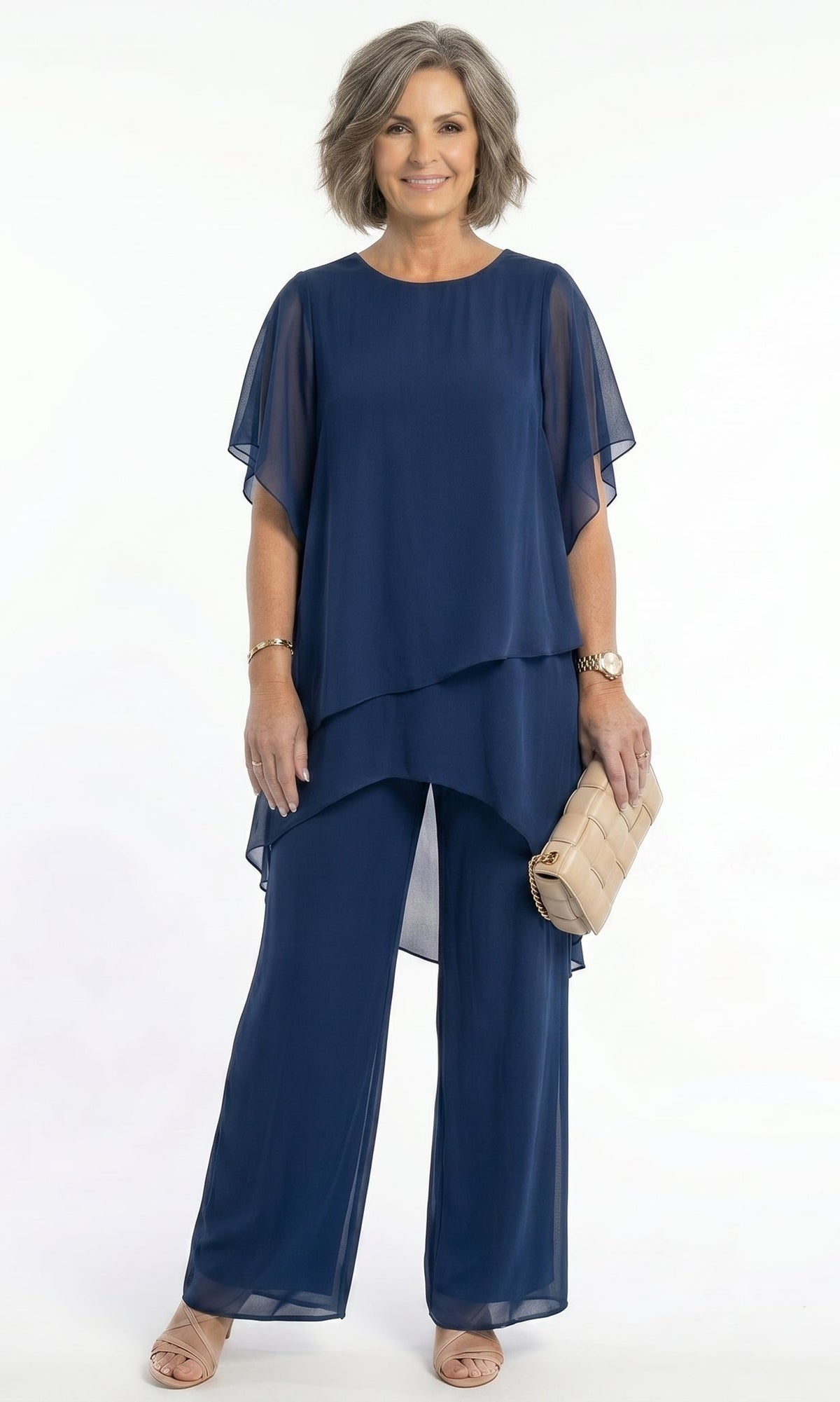 Front view of a model wearing a navy Tamsin tiered blouse, showcasing its elegant drape and short floaty sleeves.