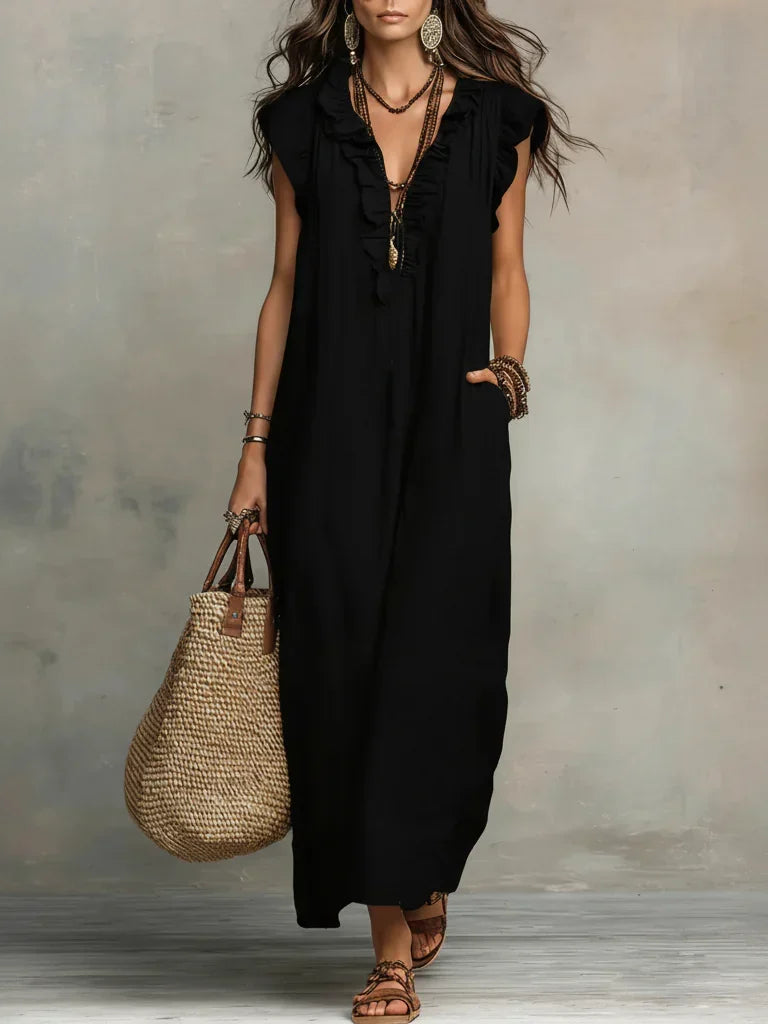 Lifestyle shot of a woman enjoying a warm afternoon, wearing the comfortable bohemian long maxi dress.