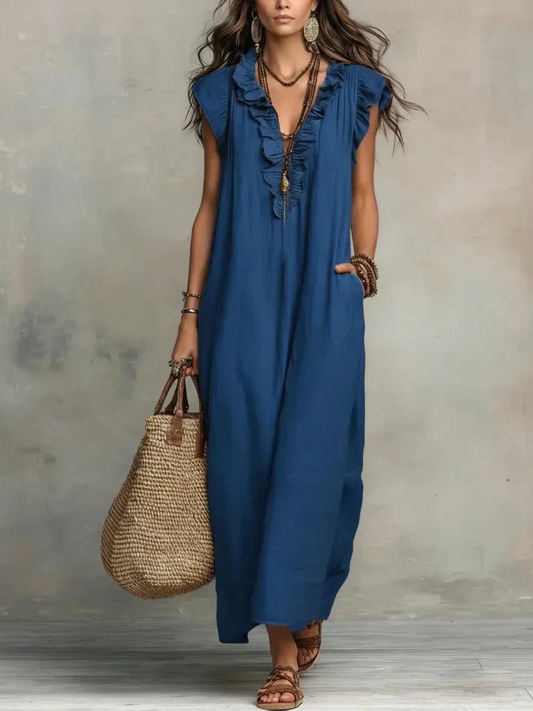 Close-up detail of the delicate ruffle trim on the bodice of the Saskia long maxi dress.