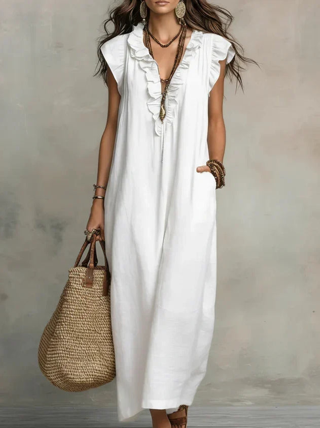 Back view of the Saskia long maxi dress, highlighting the elegant drape of the natural fabric.