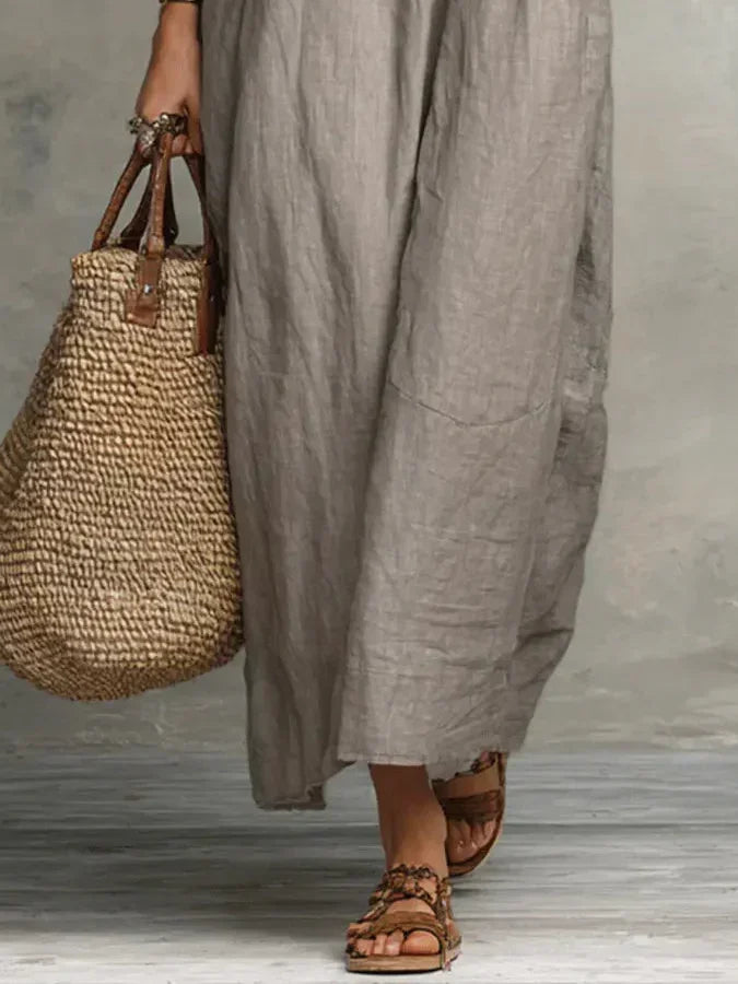 A model sitting relaxed, demonstrating the comfort and ease of the Saskia Bohemian Long Maxi Dress.