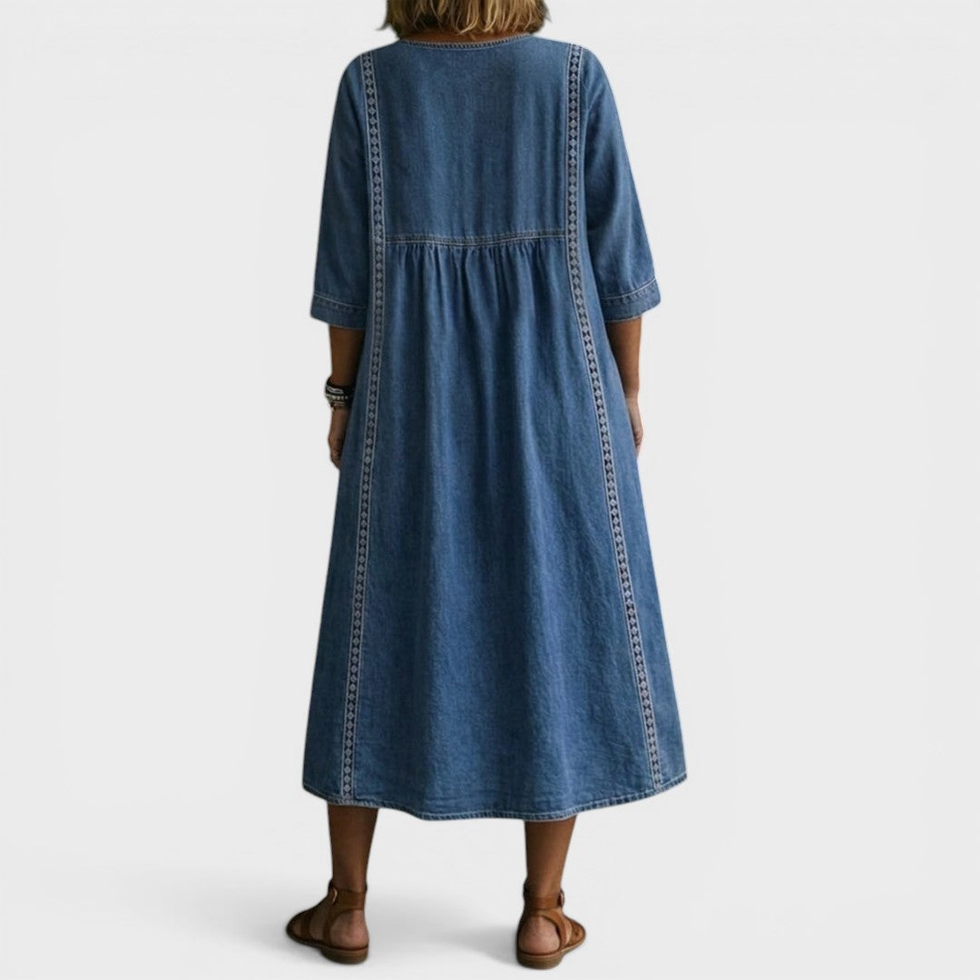 Side profile of a woman in the Romy denim jeans, highlighting the flowing cut and overall silhouette.