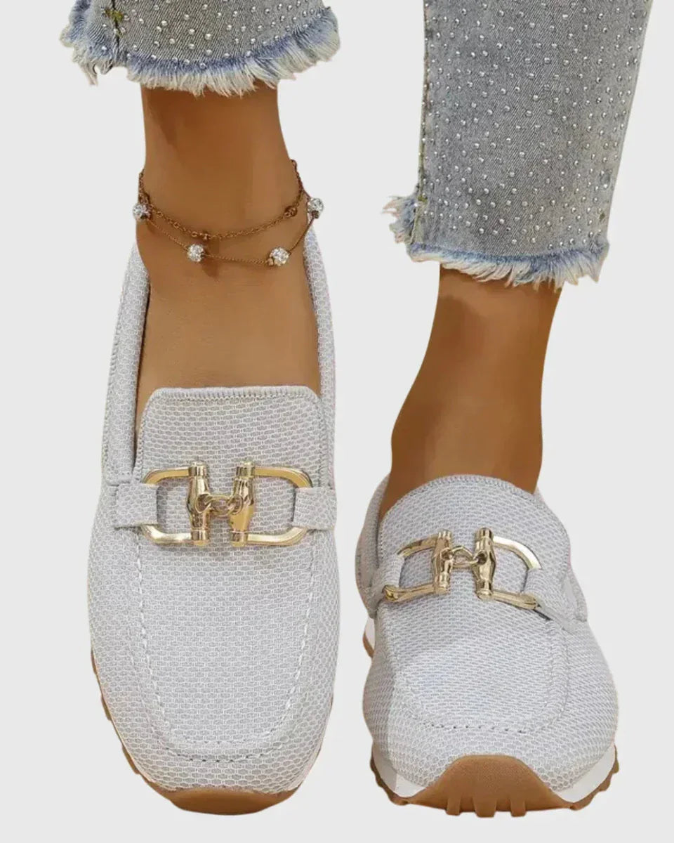 Overhead shot of white orthopedic pants, displaying the soft insole and overall structure.