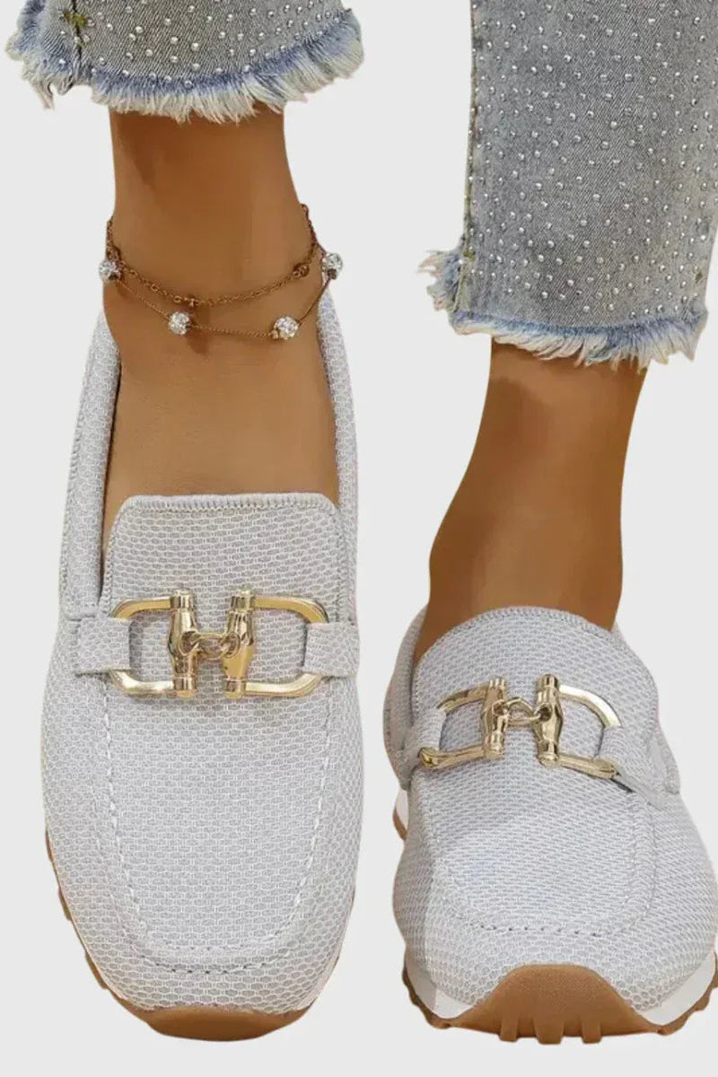 Overhead shot of white orthopedic pants, displaying the soft insole and overall structure.