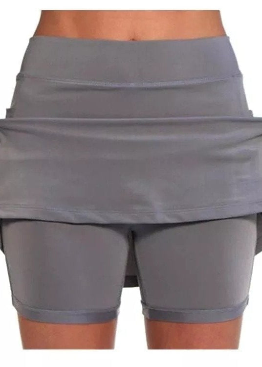 Close-up of the pocket on the orange skort, demonstrating its capacity for carrying small essentials.
