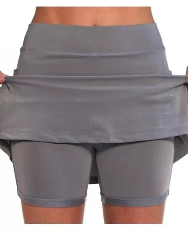 Close-up of the pocket on the orange skort, demonstrating its capacity for carrying small essentials.