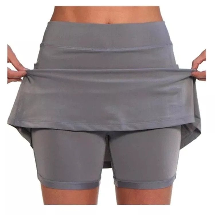 Close-up of the pocket on the orange skort, demonstrating its capacity for carrying small essentials.