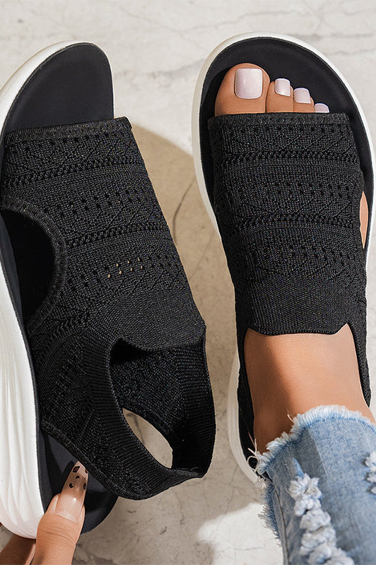 Side profile of beige knit platform sandals, highlighting the supportive platform and flexible design.
