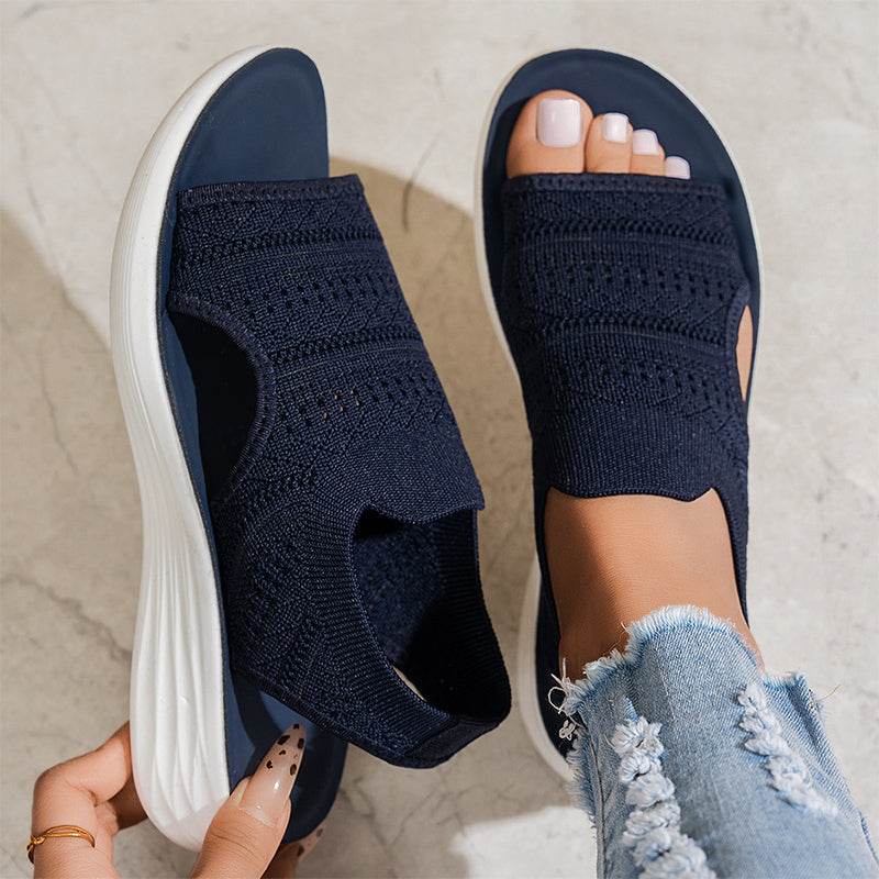 Overhead shot of gray platform sandals, displaying the cushioned footbed and overall elegant silhouette.