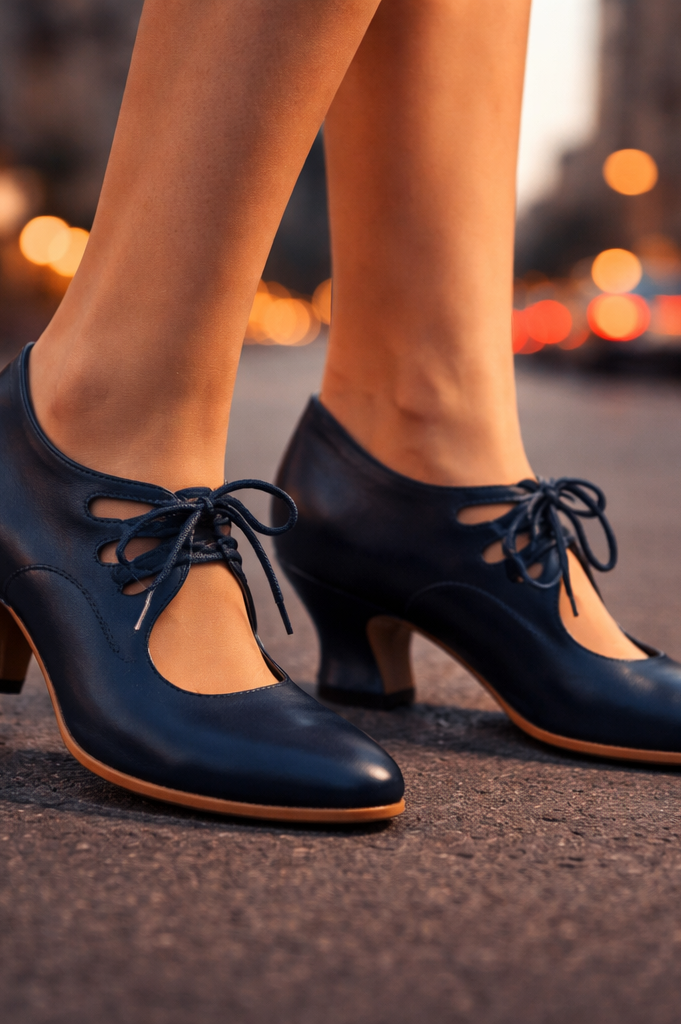 Side view of Talia elegant leather lace heels in black, showcasing the sculpted heel.